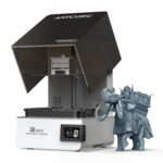 Anycubic Photon P1 Max resin 3D printer with 12K LCD, angled view next to a printed detailed elephant model